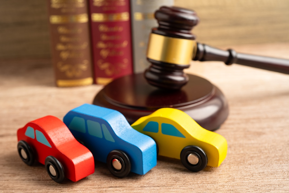 Photo of cars and a gavel